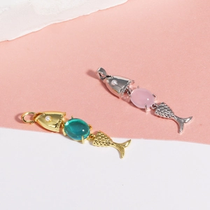 Detailed close-up of movable fish pendants with 18K gold plating and colorful oval gemstones