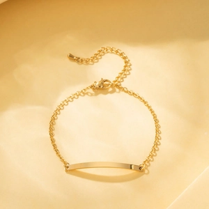 Polished gold rectangular bar bracelet with minimalist cable chain and lobster clasp closure