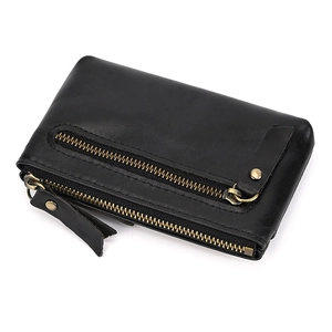 Detail of genuine black leather coin purse featuring three metal zippers and key ring