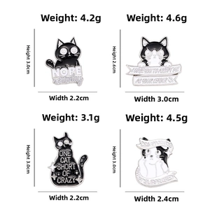 Black and white cat enamel pins set showing various sizes and weight specifications