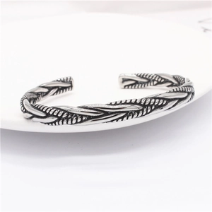 Macro shot of retro twisted cable steel bracelet with vintage silver finish detail