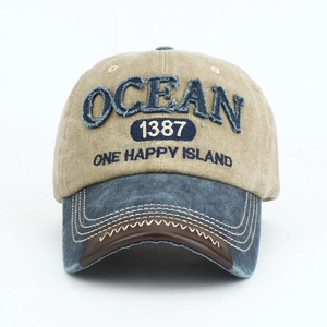Close-up of vintage baseball cap with OCEAN embroidery and contrast stitching details