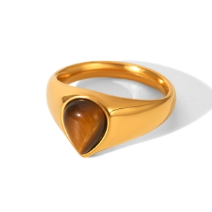 Detailed view of teardrop tiger eye stone set in a polished 18k gold stainless steel ring
