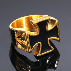 Polished gold stainless steel cross ring with black iron cross motif on black mirror