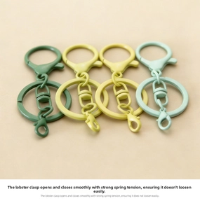 Matte finish lobster clasp keychains in green and yellow displayed at a 45-degree angle