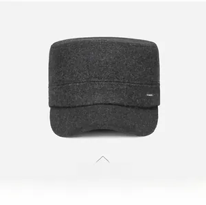 Detailed front view of charcoal grey wool cadet cap with metal Vashion logo