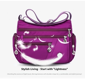 Detailed view of lightweight purple waterproof nylon crossbody bag with multiple zip pockets