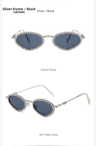 Detailed macro view of silver oval sunglasses with sparkling crystal rhinestones and dark lenses