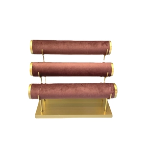 Three-tier golden velvet jewelry stand for bracelets and watches with a rose pink finish