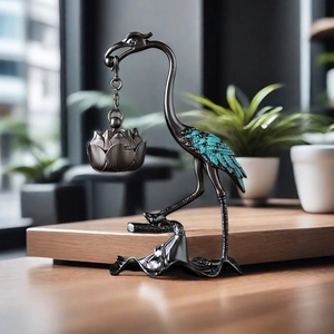 Bronze crane incense burner with hanging lotus holder on an elegant wooden tabletop