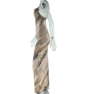 Detail of snake print pattern and texture on a sleeveless backless slim fit dress