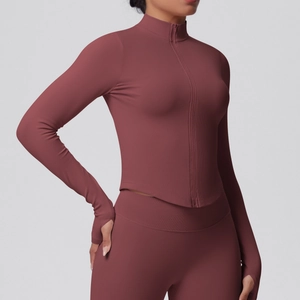 Detail of thumbhole cuffs and ribbed texture on women's high-stretch yoga jacket