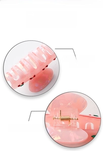 Detailed view of pink cherry hair claw clip showing smooth teeth and strong gold spring
