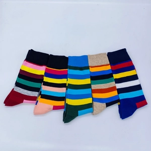 Detail view of five pairs of colorful striped cotton athletic crew socks for men in various colors