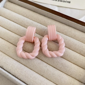 Pastel pink macaron twisted square resin drop earrings in a jewelry box