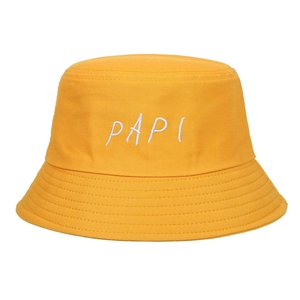 Detail of the white PAPI embroidery on a vibrant yellow cotton sun bucket hat