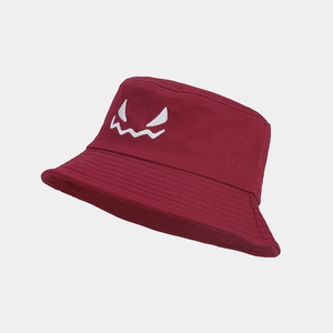 Close-up of white face embroidery on a deep red Halloween bucket hat in thick canvas
