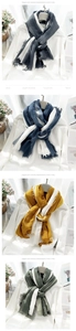Detail of soft cotton linen scarf with ombre dye effect and natural frayed edges