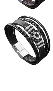 Detail of multi-layer leather soccer bracelet featuring a magnetic clasp and football charm