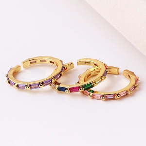 Macro shot of 18K gold plated rings with colorful rectangular zirconia gemstones