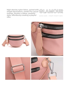 Detail view of pink nylon crossbody bag with dual zippers and adjustable fabric strap