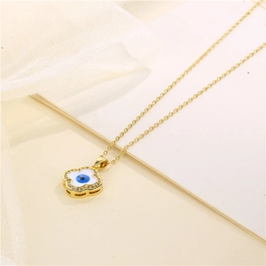 Gold evil eye clover necklace with micro-pave zircons and blue enamel detail