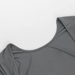 Detail of the crew neck stitching and fine knit texture on a gray backless bodysuit