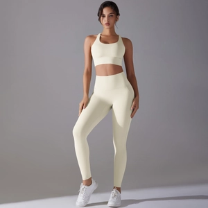 Close-up of off-white high-waisted yoga set with seamless knit texture and racerback top