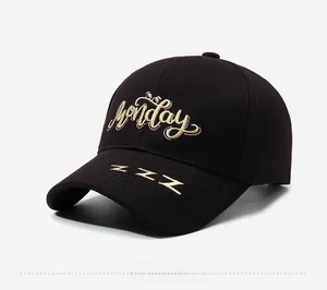 Detail of embroidered Monday letter and ZZZ symbol on dark cotton baseball cap