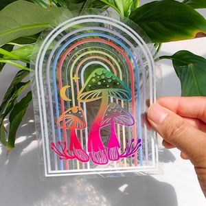Rainbow prism window decal with iridescent mushroom and arch design on glass