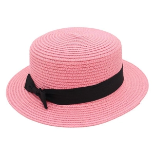 Close-up of pink straw boater hat featuring cross-weave texture and black satin bow ribbon