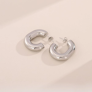 Chic silver hollow C-shaped stainless steel earrings with a polished minimalist design