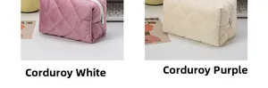 Detail of quilted corduroy makeup bags in purple and white with secure zipper closure