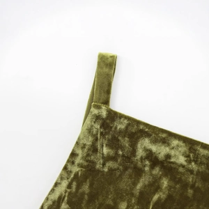 Detail shot of deep olive green velvet tank top straps with premium fiber texture