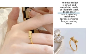 Macro detail of dainty bow-knot titanium steel ring with premium triple-layer gold plating