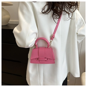 Pink PU leather square bag with lychee texture and sewing thread detail on white blazer