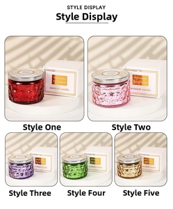 Macro view of embossed glass scented candle jars in five colors with metal lids