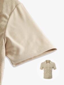 Detail of waffle knit texture and stitching on men's khaki short sleeve button-up shirt