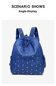 Close-up of blue lychee leather backpack with silver studs and tassel zipper detail