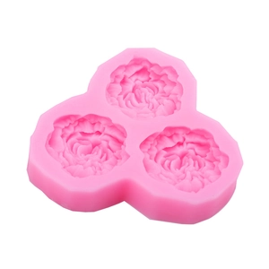 Pink silicone mold featuring three cavities of 3D carnation flower designs for DIY crafts