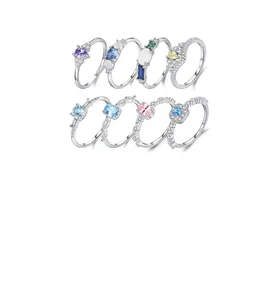 Close-up of S925 sterling silver rings set with colorful gemstones in various designs