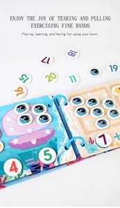 Detail of educational busy book showing number matching games and interactive cards