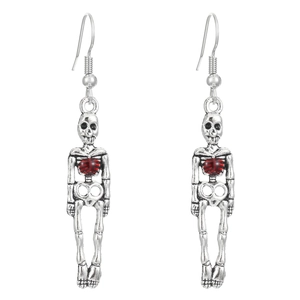 Gothic skull earrings in vintage silver with red heart accents on white background