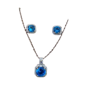 Fashionable silver necklace and earrings set with blue round stones and zircon accents
