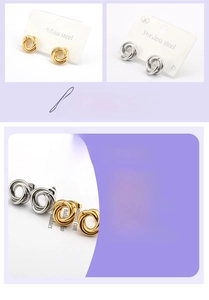 Detailed macro view of gold and silver titanium steel twisted hoop earrings with spiral texture