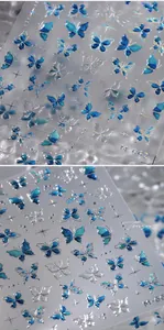 Détails d'autocollants pour ongles papillon bleu glacé avec paillettes argentées