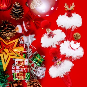 Close-up of festive Christmas pet headbands with reindeer antlers and Santa motifs