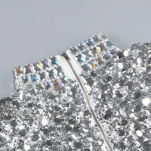Detail of silver sequins and iridescent crystals on a high-neck party dress collar