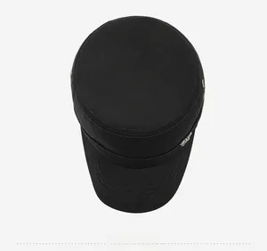 Top-down view of black flat top military cap with metal air vents and stitching details