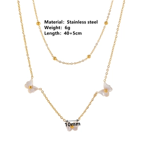 Double-layered stainless steel necklace with small gold beads and three white butterfly charms